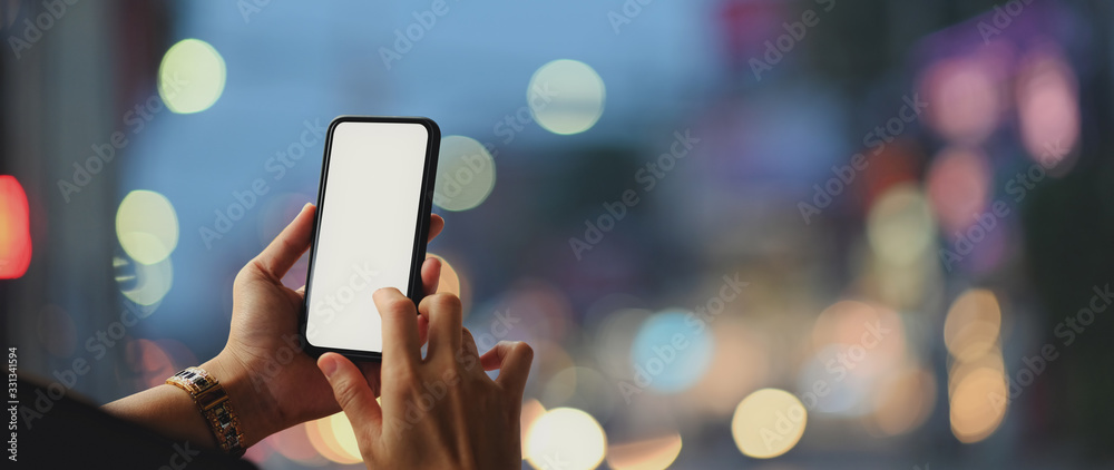 Close up view of a woman using blank screen smartphone - obrazy, fototapety, plakaty 