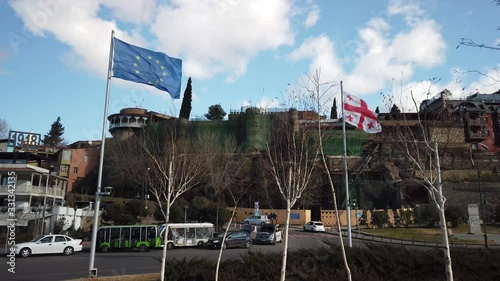 European EU flag and Georgian flag together. Tbilisi, Georgia. 4K photo