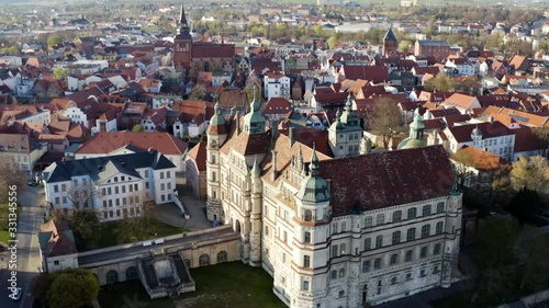 Landscape shot of a german city near the baltic sea. The drone flies around a castle. photo