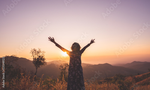 Woman spreading hands with joy and happy.