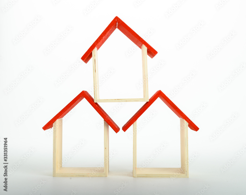 wooden mini house on the white background as business, family and property concept wooden mini house on the white background as business, family and property concept