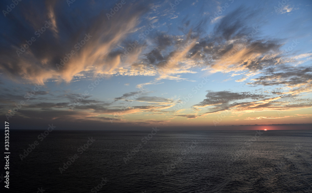 Beautiful sunset over the calm Pacific Ocean. Beautiful sunset over the calm Pacific Ocean.