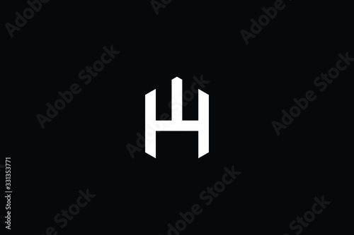 Minimal elegant monogram art logo. Outstanding professional trendy awesome artistic HW WH initial based Alphabet icon logo. Premium Business logo White color on black background