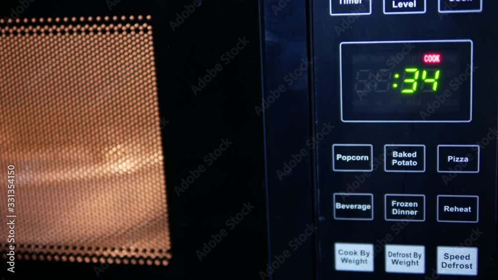 Motion of food being heated in microwave oven with 4k resolution Stock