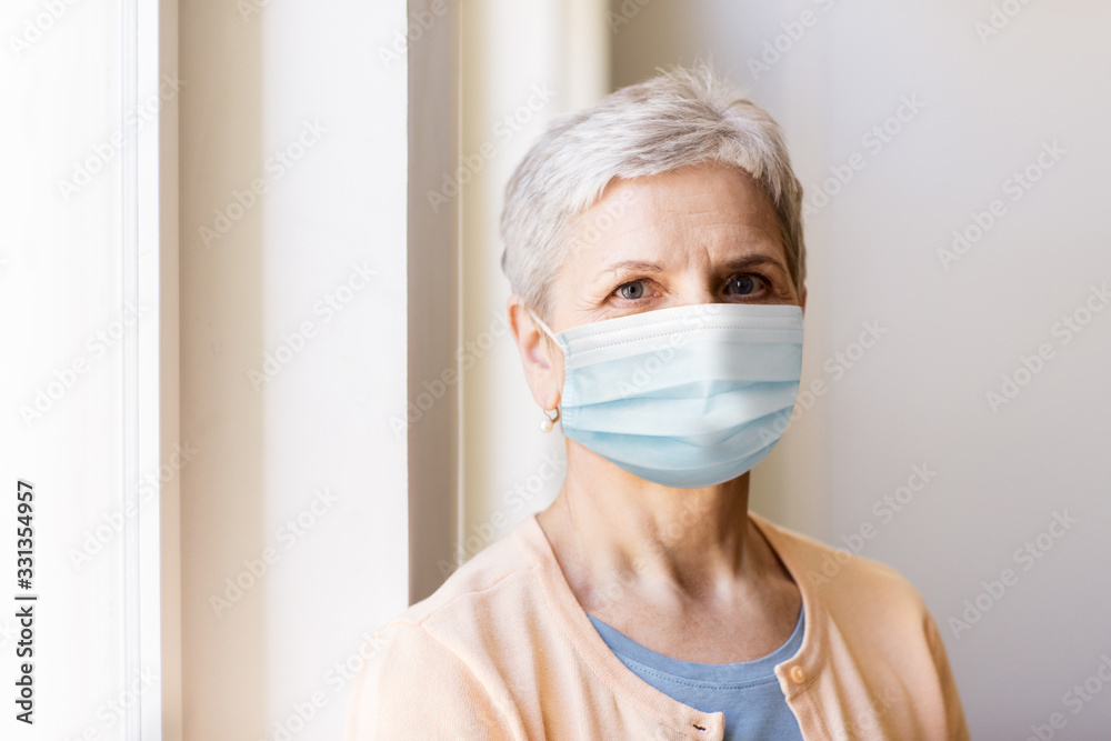 health, safety and pandemic concept - senior woman wearing protective medical mask for protection from virus - obrazy, fototapety, plakaty 