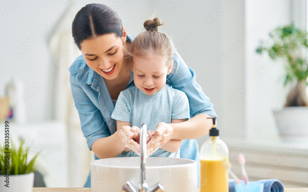girl and her mother are washing hands - obrazy, fototapety, plakaty 