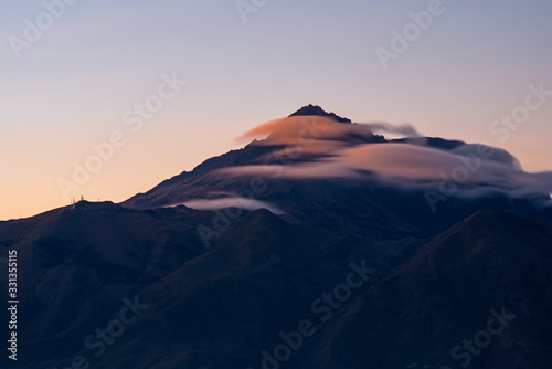 Long exposure of the majestic Cotacachi volcano seen from Otavalo at sunset, North of Quito, Ecuador. photo