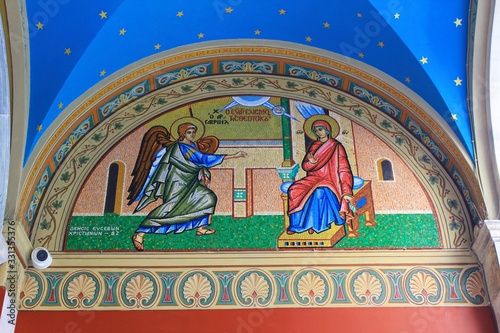 Beautiful mosaic showing the Annunciation to the Virgin Mary outside of Christian orthodox church in Athens, Greece. © Theastock