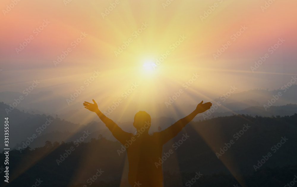 Fototapeta premium man praying to god on the mountain