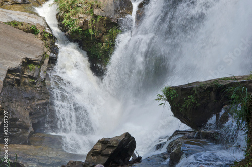 Beautiful white waterfall on rock cliff