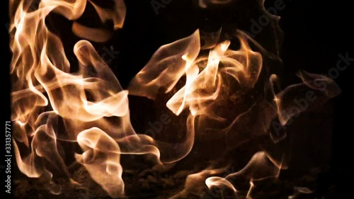 Fire flames and sparks in slow motion on black background