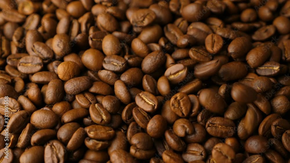 Coffee beans falling in slow motion Coffee beans falling in slow motion