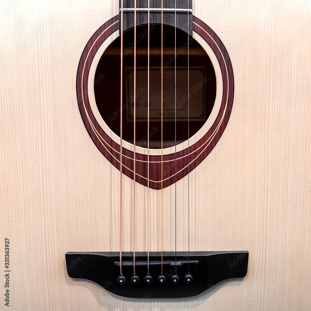 Obraz premium Six- string acoustic guitar close -up.