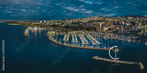 Foto Aerial drone panorama of morning in Lausanne, Switzerland, with view froum Ouchy towards the city