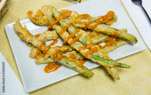 Asparagus fried in batter with romesco sauce