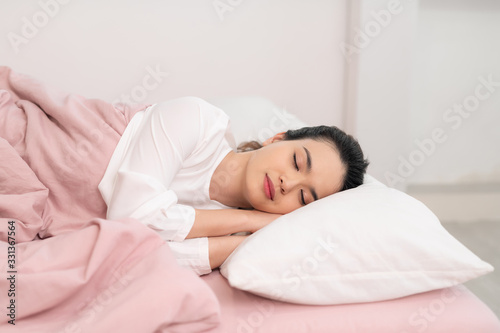 Beautiful Asian woman sleep and sweet dream on bed in bedroom in the morning,Healthcare Concept
