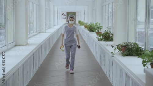 Masked doctor walks down corridor with biohazard tests at Russian hospital, Moscow clinic