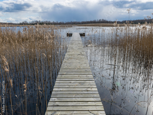 landscape with wooden footbridge in the center © ANDA