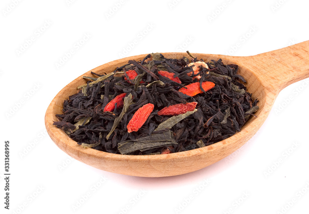 Dry tea in a wooden spoon, isolated on white background, delicious, natural Dry tea in a wooden spoon, isolated on white background, delicious, natural