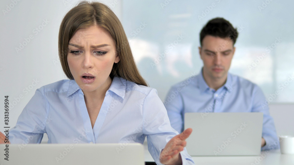Young Businesswoman Upset by Financial Loss at Work Young Businesswoman Upset by Financial Loss at Work