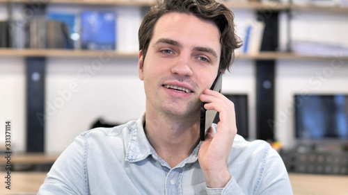 Portrait of Young Man Talking on Phone