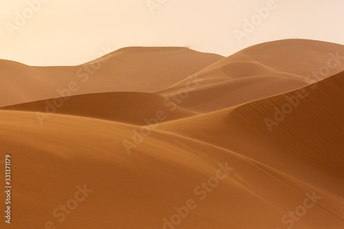 Desert Sahara with beautiful lines and colors at sunrise. Merzouga, Morocco © danmir12