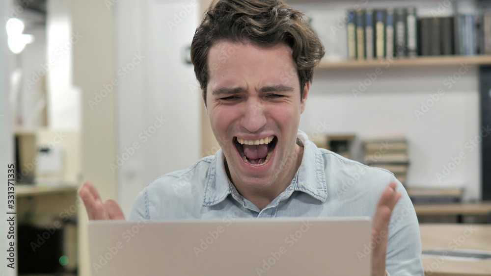 Angry Creative Man Screaming while Reacting to Loss Angry Creative Man Screaming while Reacting to Loss