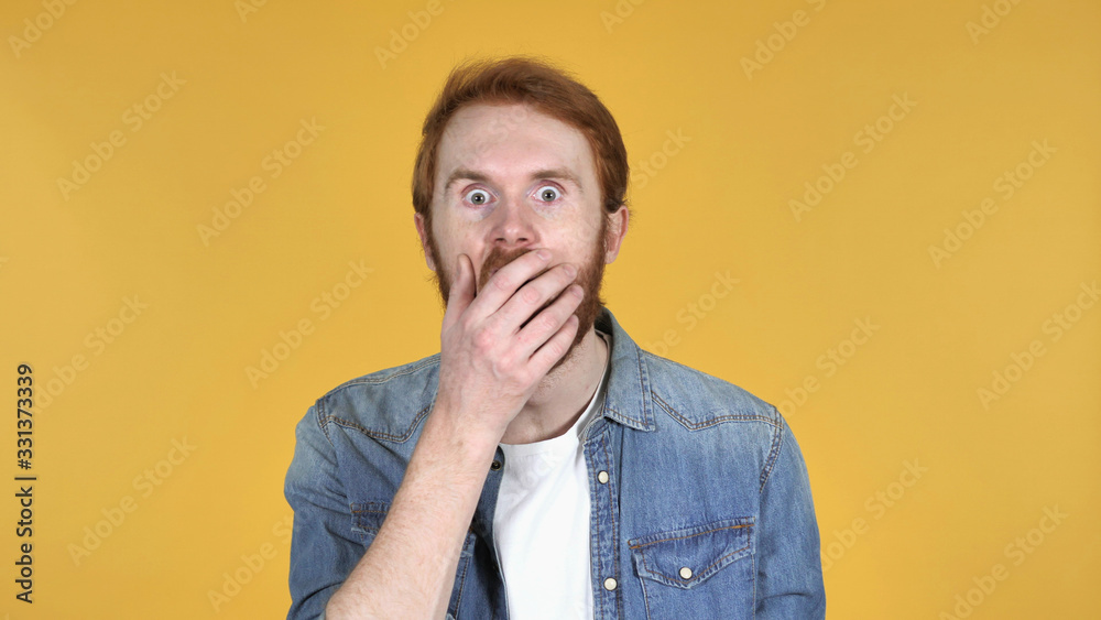 Redhead Man in Shock on Yellow Background, wondering Redhead Man in Shock on Yellow Background, wondering
