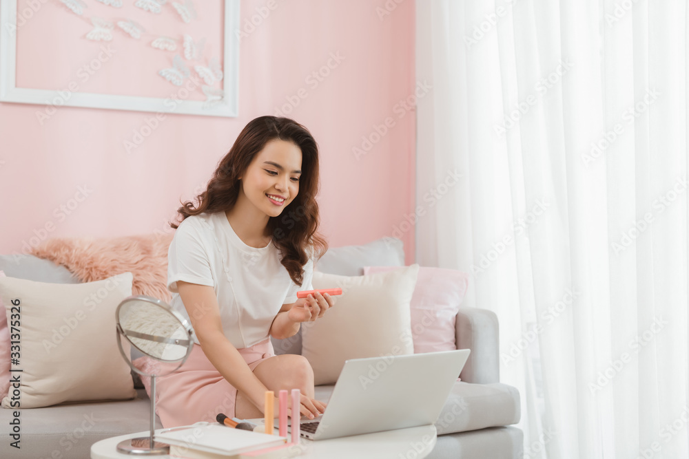 Startup small business owner working with computer at workplace. Freelance woman seller check product order. Startup small business owner working with computer at workplace. Freelance woman seller check product order.