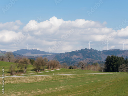 Landscape of Black-Forest in Germany. View from the Lake Eichen to Gersbach summit and hills with its wind turbines 