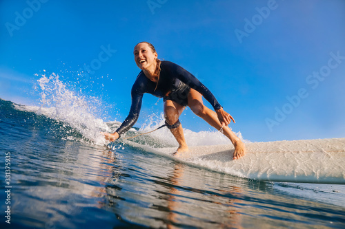 Photography Female surfer on a wave
