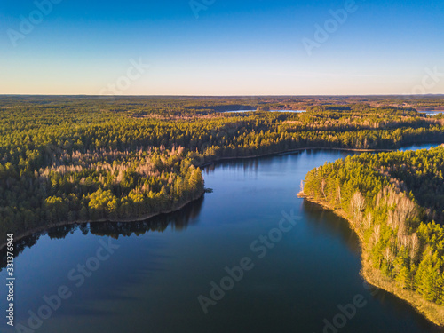 Lake with the forests in the evening light