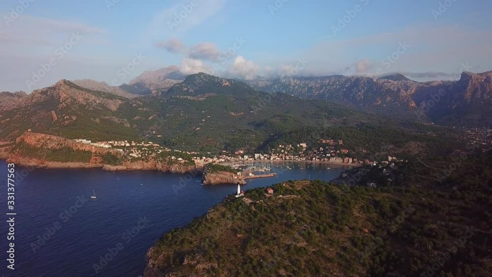 Aerial view of a white lighthouse in Port de Soller, Mallorca, Spain Aerial view of a white lighthouse in Port de Soller, Mallorca, Spain