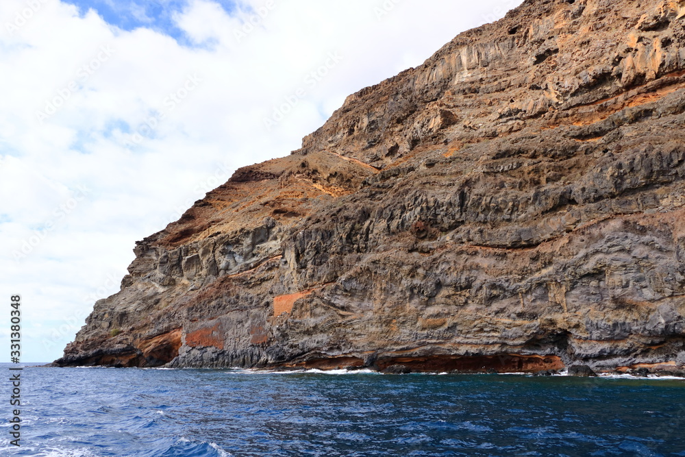 Rocky cliffs on the shore on the coast of La Gomera Island, Canary Islands in Spain