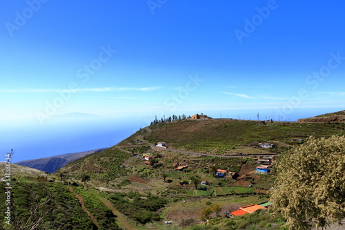 Monument of whistling language at the overlook Mirador de Igualero and the church Iglesia de San Francisco in the highland of La Gomera, Canary Islands, Spain photo