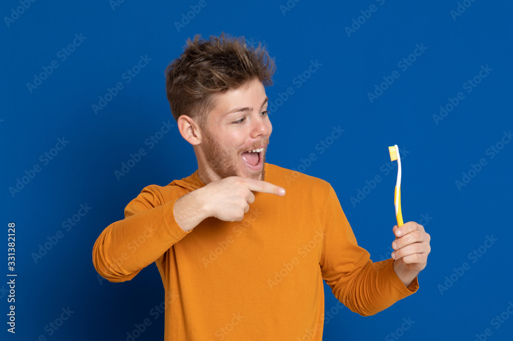 Attractive young guy with a yellow T-shirt Attractive young guy with a yellow T-shirt