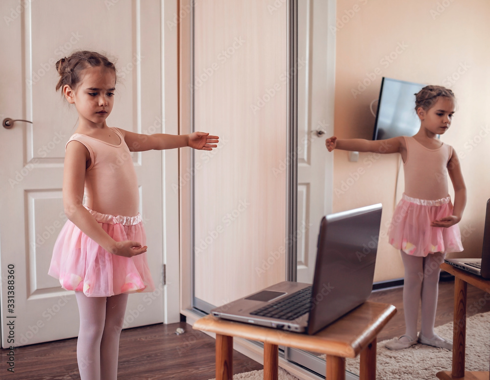 Young ballerina practicing classic choreography during online class in  ballet school, self-isolation Stock Photo | Adobe Stock