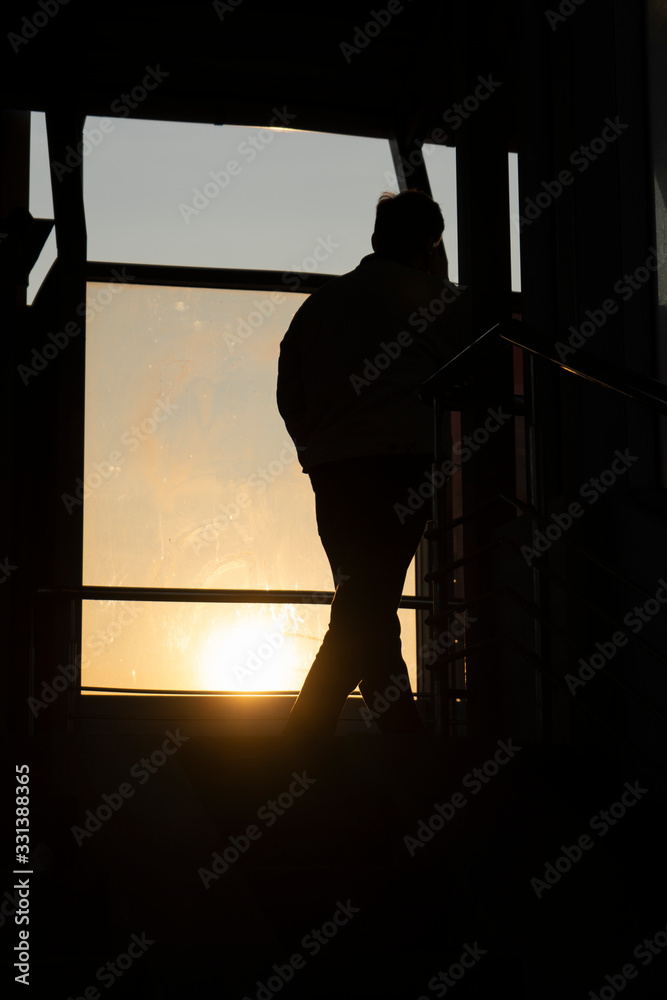 Silhouette of walking man, sunlight