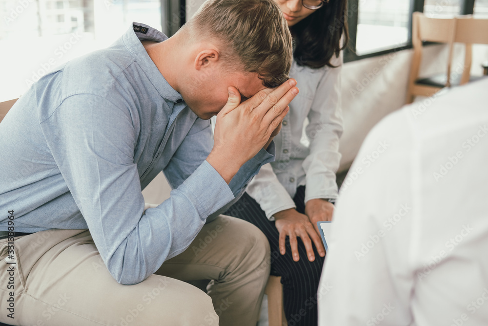 phychiatrist phychologist counselor therapist consulting giving relationship advice to couple. marrigae counseling