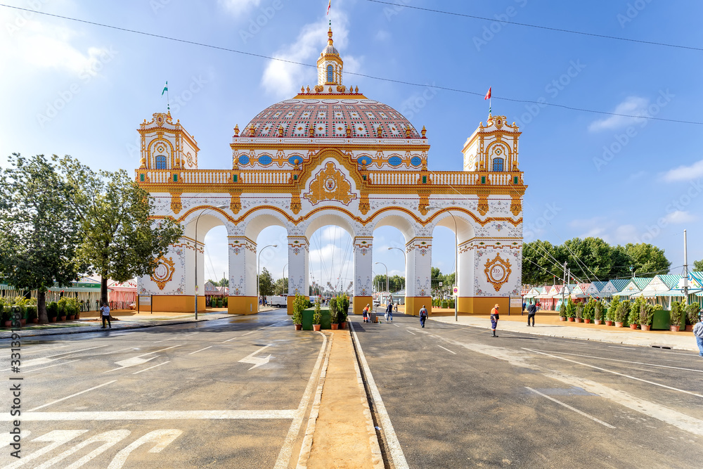 Fototapeta premium Front view of Entrance arch (Portada) to the April Fair ((Feria de Abril) at morning, Seville Fair (Feria de Sevilla), Andalusia, Spain