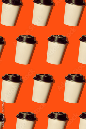 Wallpaper Mural Coffee to go regular pattern made of photo on a lush lava background. Kraft paper cups with black lids and natural bright sun shadows. Lifestyle take away hot drinks concept. Trendy flatlay, top view. Torontodigital.ca
