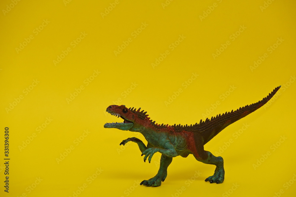 Fototapeta premium colored dinosaur toy two-legged predator