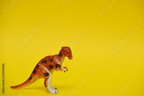 brightly colored model of a toy dinosaur