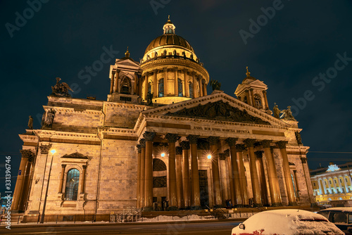 view of the majestic facade of St. Isaac's Cathedral against the dark night sky © westermak15