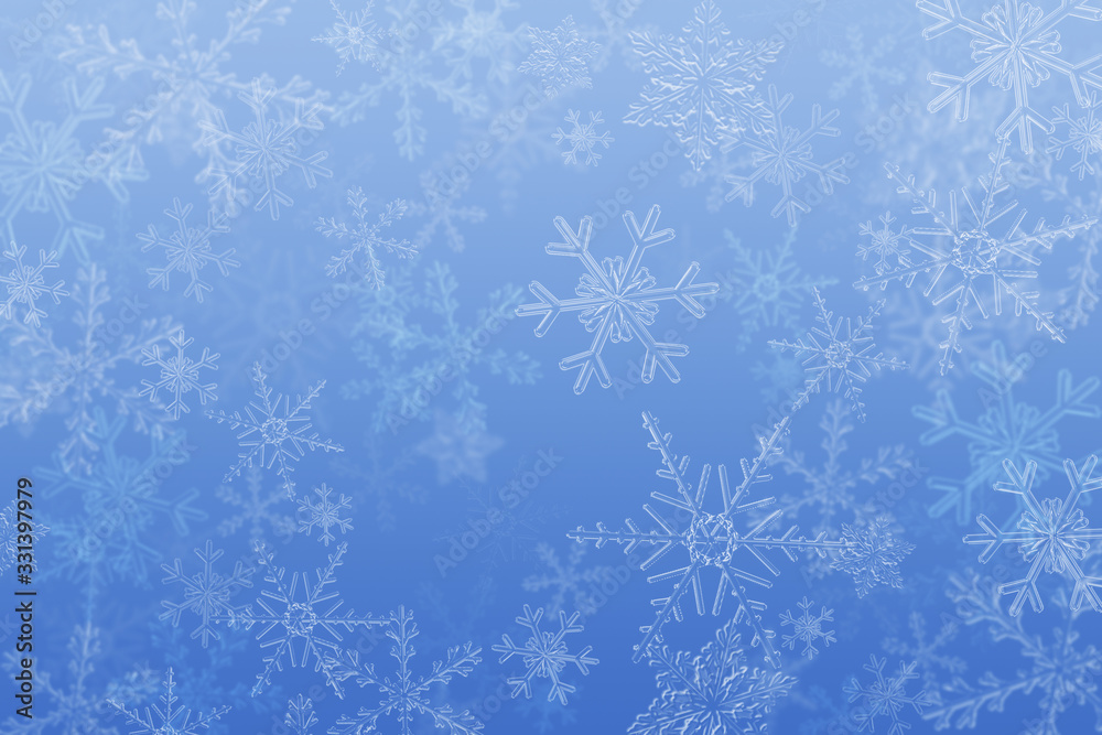 Snowfall background made of snowflakes.White snowflakes on blue Snowfall background made of snowflakes.White snowflakes on blue