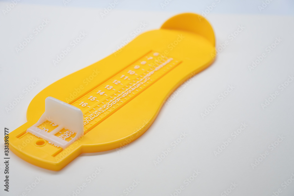 Foot Measurement on white background. Concept for shoe size and foot fitting . Foot Measurement on white background. Concept for shoe size and foot fitting .