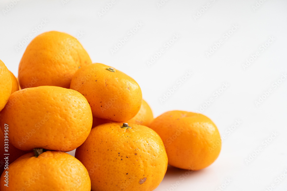 multiple orange on white marble surface. Concept for fruit nutrition and diet food. multiple orange on white marble surface. Concept for fruit nutrition and diet food.