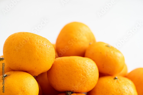multiple orange on white marble surface. Concept for fruit nutrition and diet food.
