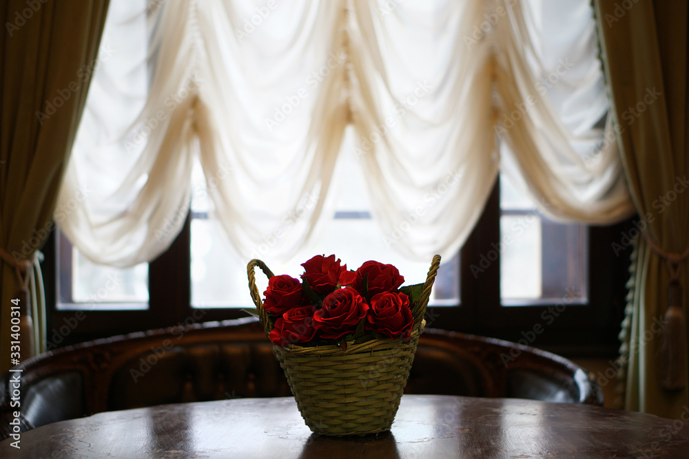 Basket of roses in room