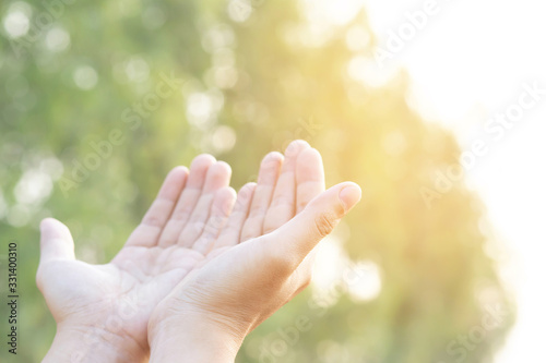 Human hands open palm up worship Praying hands with faith and belief in God of an appeal to the sky. Concept Religion and spirituality with believe Power of hope or love and devotion.